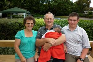 Diane and David Broderick with David Sullivan, 19, and a baby they're looking after. Photo / Supplied