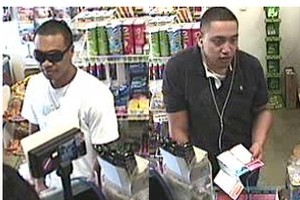 Police investigating Tuesday's armed robbery on the corner of Victoria and High Sts, central Auckland, want to identify these two men, sought in connection with a bag snatch last month. Photo / Supplied