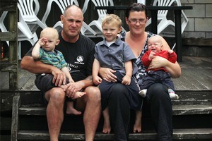 Craig Bradley and Carla Bradley with their three sons, Jayden (15 months), Alex (11 months) and Cane (3), at their rented home in Papakura. Photo / Greg bowker