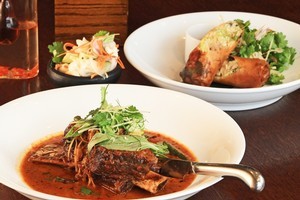 MooChowChow's slow-cooked beef rib with Thai basil in red curry and crispy pork roll. Photo / Greg Bowker