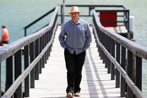 Craig Cooper takes time out to enjoy the sun on Beach Haven Wharf, Auckland. Photo / Steven McNicholl