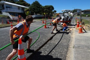 Workers laying fibre optic cabling. Photo / supplied