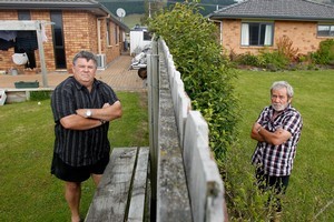 Grant Collins (left) and John Grundy live in Western Rd, Ngongotaha, where the houses are sinking. Photo / Christine Cornege