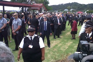 Prime Minister John Key is surrounded by a sea of security officials as he prepares to leave Te Tii Marae. Photo / NZ Herald