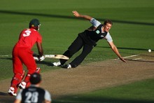 Michael Bates fields off his own bowling in the second Twenty20 clash against Zimbabwe. Photo / Getty Images
