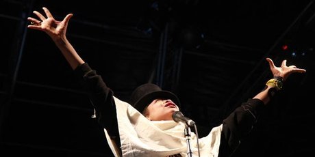 Some danced in bikinis as rain fell during Erykah Badu's performance. Photo / Supplied