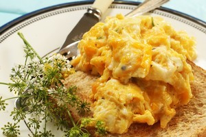 Scrambled eggs with chive flowers. Photo / Janna Dixon