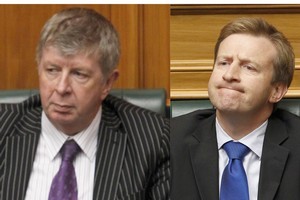 Land Information Minister Maurice Williamson and Associate Finance Minister Jonathan Coleman react as the PM comes under fire over decision ordering a rethink of the Crafar deal during question time yesterday. Photo / Mark Mitchell