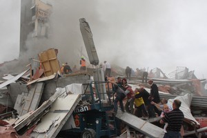 Rescuers search for survivors on top of rubble at the CTV site. Photo / Geoff Sloan