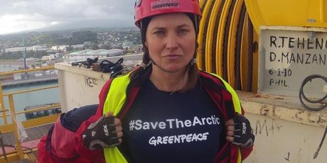 Seven Greenpeace protesters, including Hollywood star Lucy Lawless, clambered onto an Arctic-bound oil drilling vessel and scaled its 53-metre tower at Port Taranaki this morning. Photo / Greenpeace