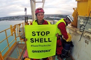 Lucy Lawless and Greenpeace activists protesting on board a Shell-contracted oil drillship in Port Taranaki. Photo / Greenpeace