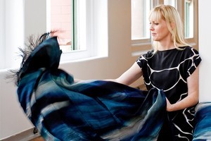 Emma Hayes holds her Riverbed screen-printed bed throw from her MM Collection. Photo / Babiche Martens
