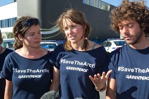 Lucy Lawless, centre, with Greenpeace activists outside New Plymouth's central police station, after their release on bail on charges relating to their 77-hour occupation of an oil ship. Photo /Greenpeace