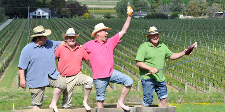 David Hart from StoneBridge, and Geordie Witters and Paul Tietjen from TW Wines, salute Steve Voysey from Spade Oak before the Meet the Makers vineyard tour. Photo / Dave Thomas, Gisborne Herald