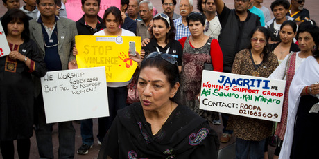 Roopa Suchdev, with members of the local Indian community, speaks out against violence towards women. Photo / Greg Bowker