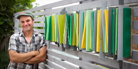 Justin's homemade wall decoration using off-cuts has added another dimension to his outdoor space, giving it an 'outdoor room' feel. Photo / Natalie Slade