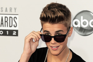 Police say a paparazzo was hit by a car and killed after taking photos of Justin Bieber. Photo / AP