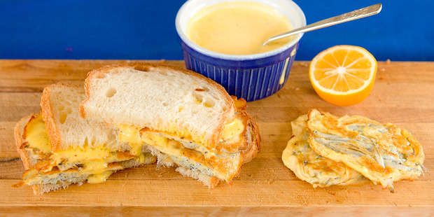 Aioli, here served with bread and whitebait fritters, can vary greatly from recipe to recipe. Photo / Babiche Martens