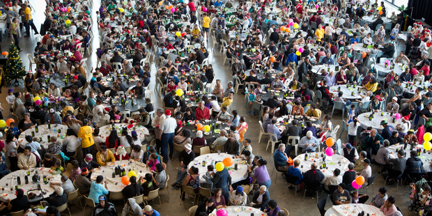 The Chinese tourists were among 2800 people at the Auckland City Mission's Christmas dinner. Photo / Richard Robinson
