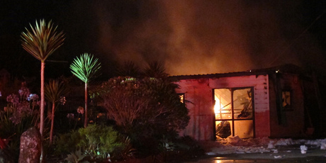 The burning shed contained 300kg of fireworks as well as cyanide for possum trapping. Photo / Peter de Graff