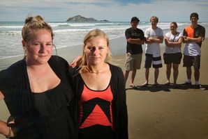 Laura Donovan (left) and Lynda Coldicutt, with their friends, pulled a collapsed, drunken man from the surf at Waimarama Beach. Photo / Warren Buckland