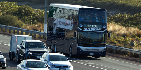 Auckland Transport's new double decker bus makes a run on the Northern Motorway in Auckland. Photo / Brett Phibbs