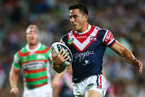 Sonny Bill Williams of the Roosters heads for the try line to score. Photo / Getty Images