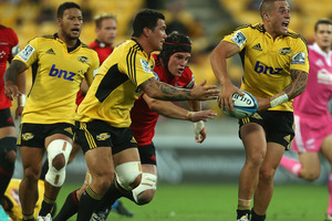 TJ Perenara of the Hurricanes looks to pass during the round four Super Rugby match between the Hurricanes and the Crusaders. Photo / Getty Images.