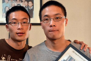 Peter Lim (right) and his twin brother Andrew speak out after Peter was subjected to racial abuse in Dunedin's Octagon this week. Photo / Stephen Jaquiery