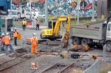 Work goes on at a Morningside level crossing after a near-fatal incident involving a woman in a wheelchair. Photo / Doug Sherring 