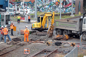 Work goes on at a Morningside level crossing after a near-fatal incident involving a woman in a wheelchair. Photo / Doug Sherring