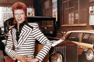 British rock singer, David Bowie, poses beside his Rolls Royce in May 1973. Photo / AP