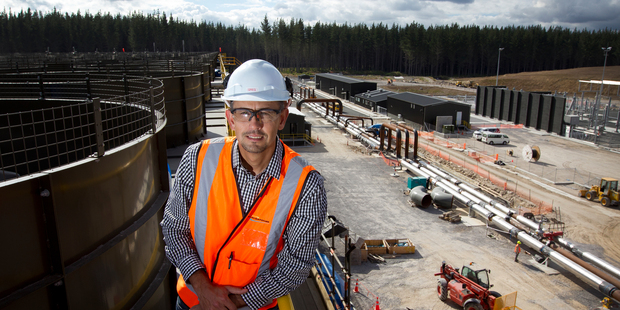 Site Manager Greg Thompson on top of Ngatamariki Power Station with some of the 240 cooling fans. Photo / NZH