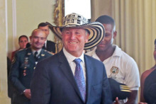 Prime Minister John Key accepted his fate and wore a sombrero vueltiao, given to him by a Colombian rugby representative. Photo / Supplied 