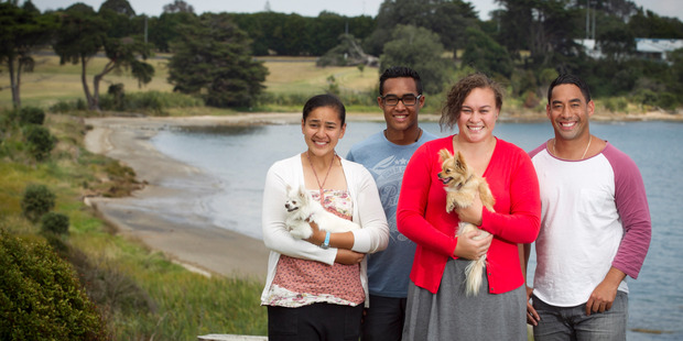 Flora Apulu (centre) with her brothers Melvin (right) and Geovanni, sister Georavi, and chihuahua's Snowey and Tapu at Weymouth Park. Photo / NZH