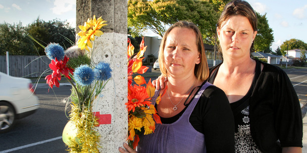 Sonia Ross and Hayley Berriman, aunties of a 12-year-old boy who was killed on Guppy Rd two years ago, are disappointed the roadside tributes are to be removed. Photo / Warren Buckland