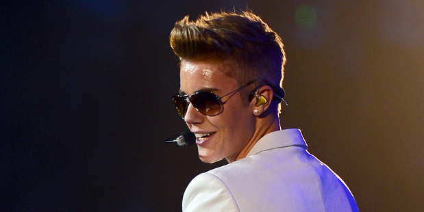 Justin Bieber says he's nothing like Lohan. Photo / AP