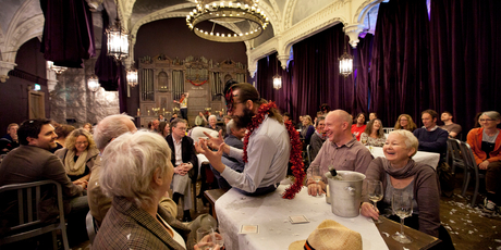 Alasdair Macrae on the table, in The Strange Undoing of Prudencia Hart. Photo / Supplied