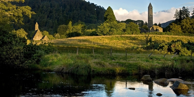 The ruins of the 6th-century monastic settlement of Glendalough, founded by St Kevin, rest in the Wicklow mountains. Photo / Supplied