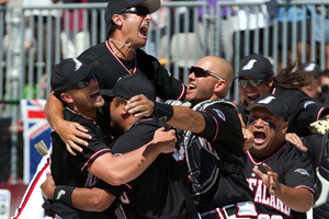 The Black Sox celebrate after their 4-1 win against Venezuela in the final of the men's world softball championships at Rosedale Park, Albany, yesterday. Photo / Brett Phibbs