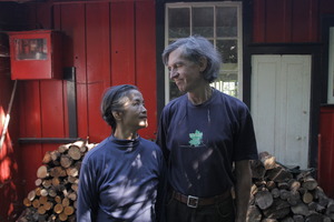 The Red House's human characters Meng Jia and Lee Stuart beside the house. Photo / Supplied