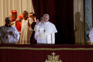 Pope Francis flanked by Monsignor Guido Marini, master of liturgical ceremonies, waves to the crowd. Photo / AP