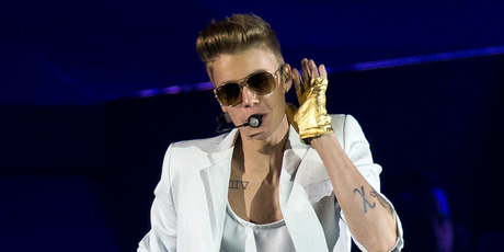 Justin Bieber performing onstage at the o2 Arena in east London, last Friday. Photo / AP