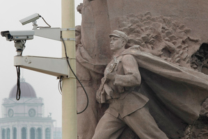 A security camera keeps watch over Tiananmen Square in Beijing. Photo / Kenny Rodger