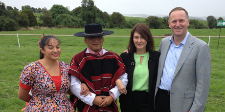 New Zealand Prime Minister John Key and wife Bronagh Key with Chilean dancers at the Soprole farm owned by Fonterra in Chile. Photo / Supplied