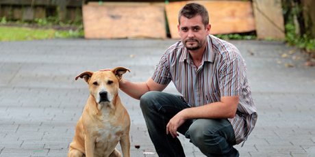 Toby Conway pictured with Stan two years ago, claims his dog died on holiday. Photo / Doug Sherring