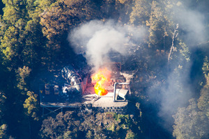 Flames leap from the ventilation shaft at the Pike River Mine in November 2010. Photo / Mark Mitchell