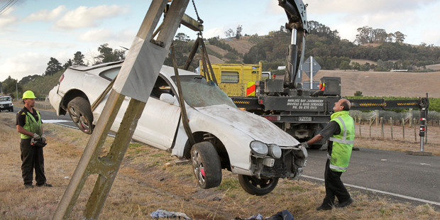 A car crashed at speed with four on board and hit a power pole while overtaking another car in Hawke's Bay. Photo / APN