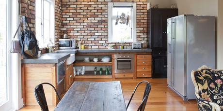 When the planned concrete floors didn't suit the style of the home, the Elsmores opted for a concrete benchtop. Photo / Your Home and Garden