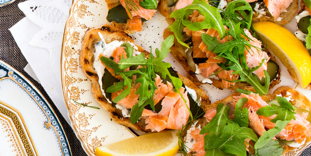 Gherkin and salmon bruschetta with rocket. Photo / Babiche Martens
